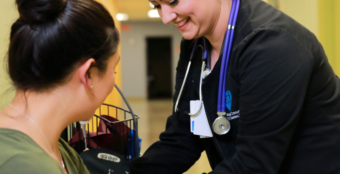 Nurse taking a patients blood pressure