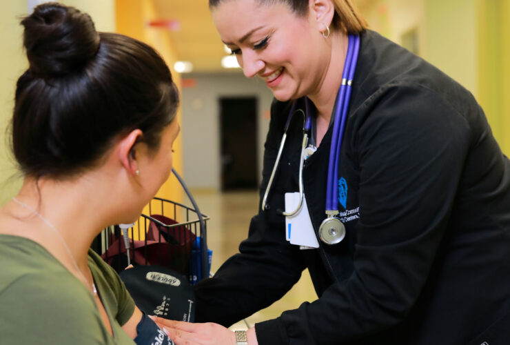 Nurse taking a patients blood pressure