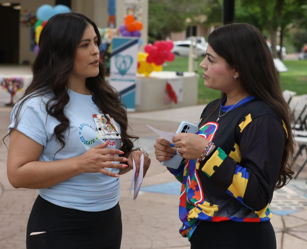 Angelica Lopez, community engagement specialist for Chiricahua, talks with Alejandra Franco, whose son Max has been a part of the Autistic Walk since it first began, at Saturday's event in Douglas.Bruce Whetten Herald/Review